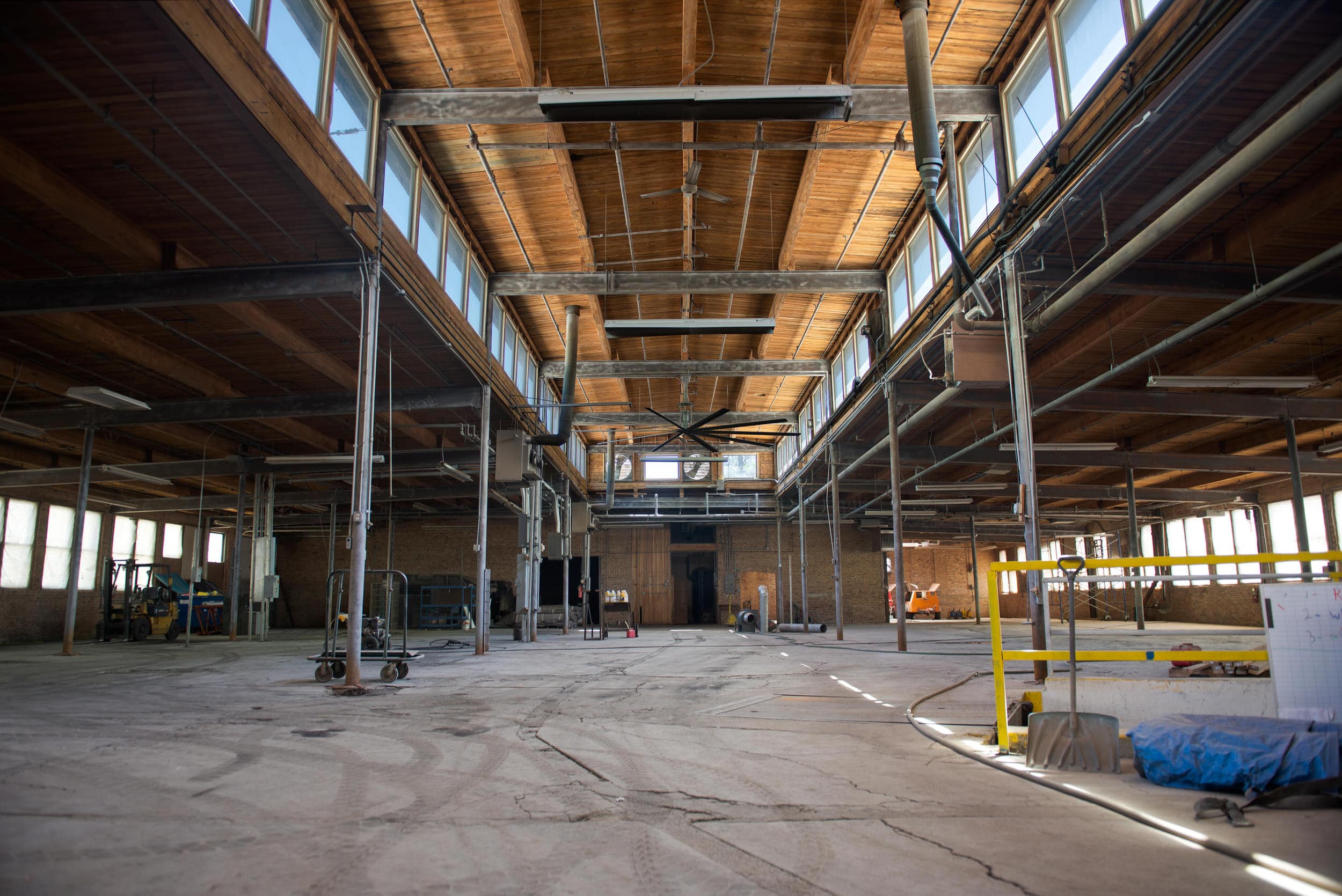 Interior of recently rehabbed industrial, brick and timber, warehouse, former factory with natural lighting