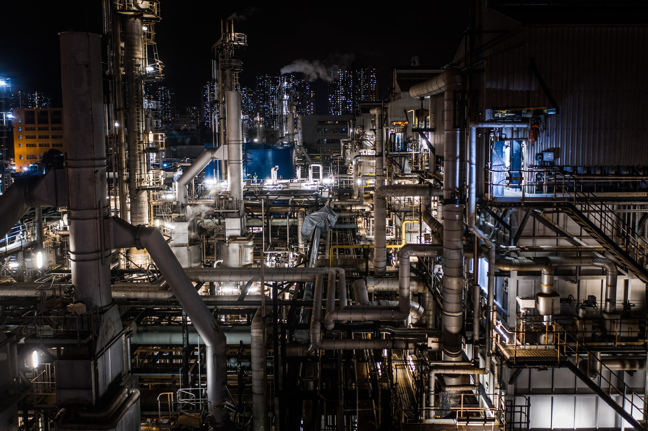 Oil Refinery, Chemical & Petrochemical plant abstract at night.